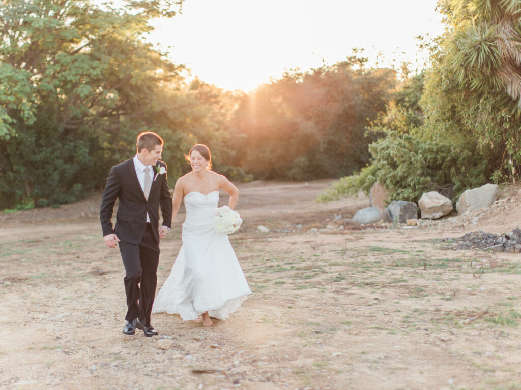 Maggie and Travis running to their wedding reception